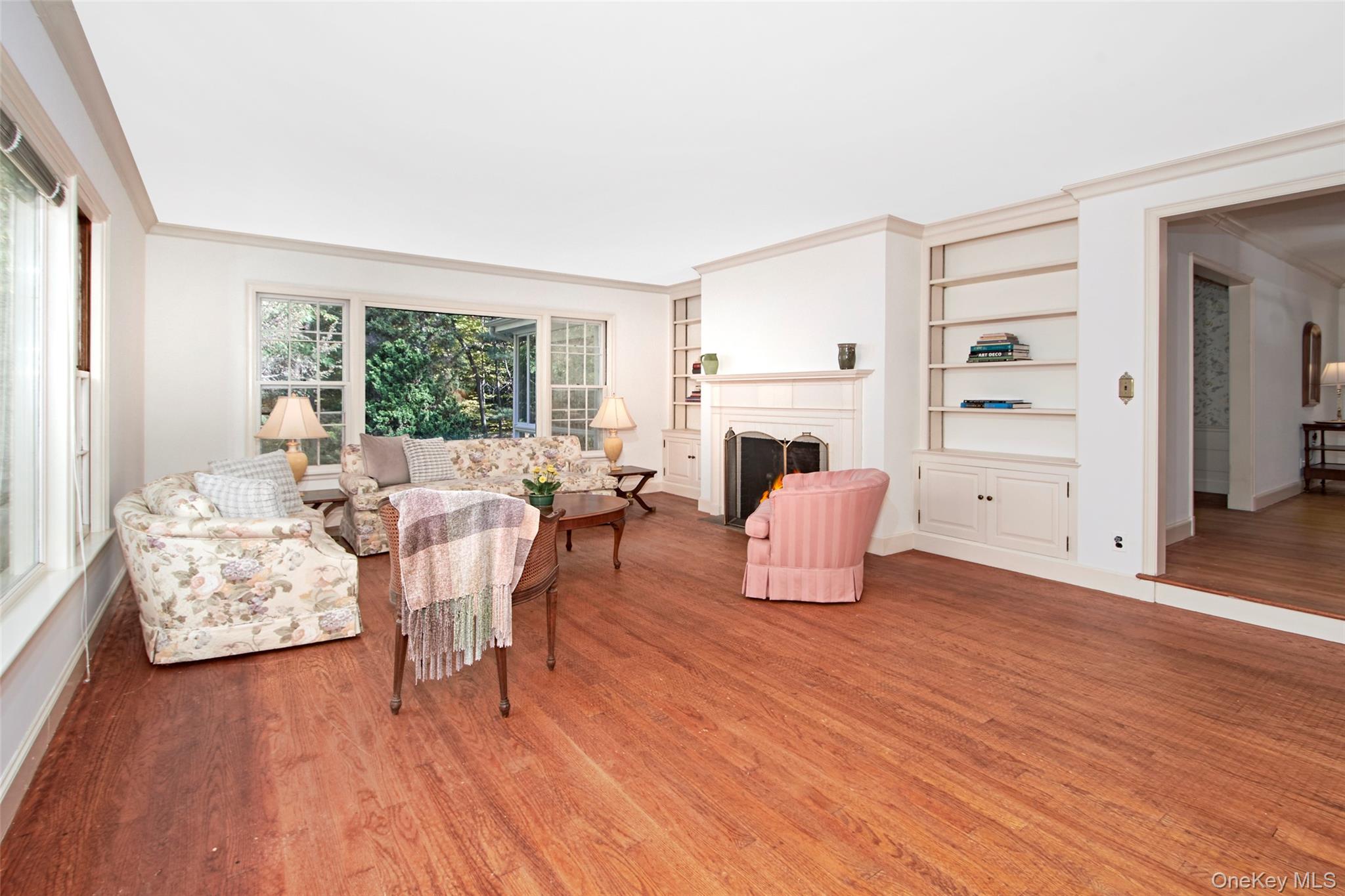 71 Commodore Road Chappaqua, NY 10514 - Photo 12 of 39 a living room with furniture and a wooden floor