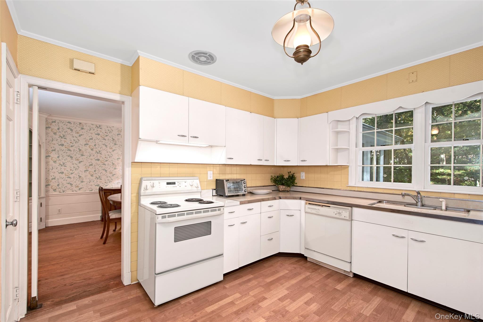 71 Commodore Road Chappaqua, NY 10514 - Photo 16 of 39 a kitchen with a stove a sink and a window