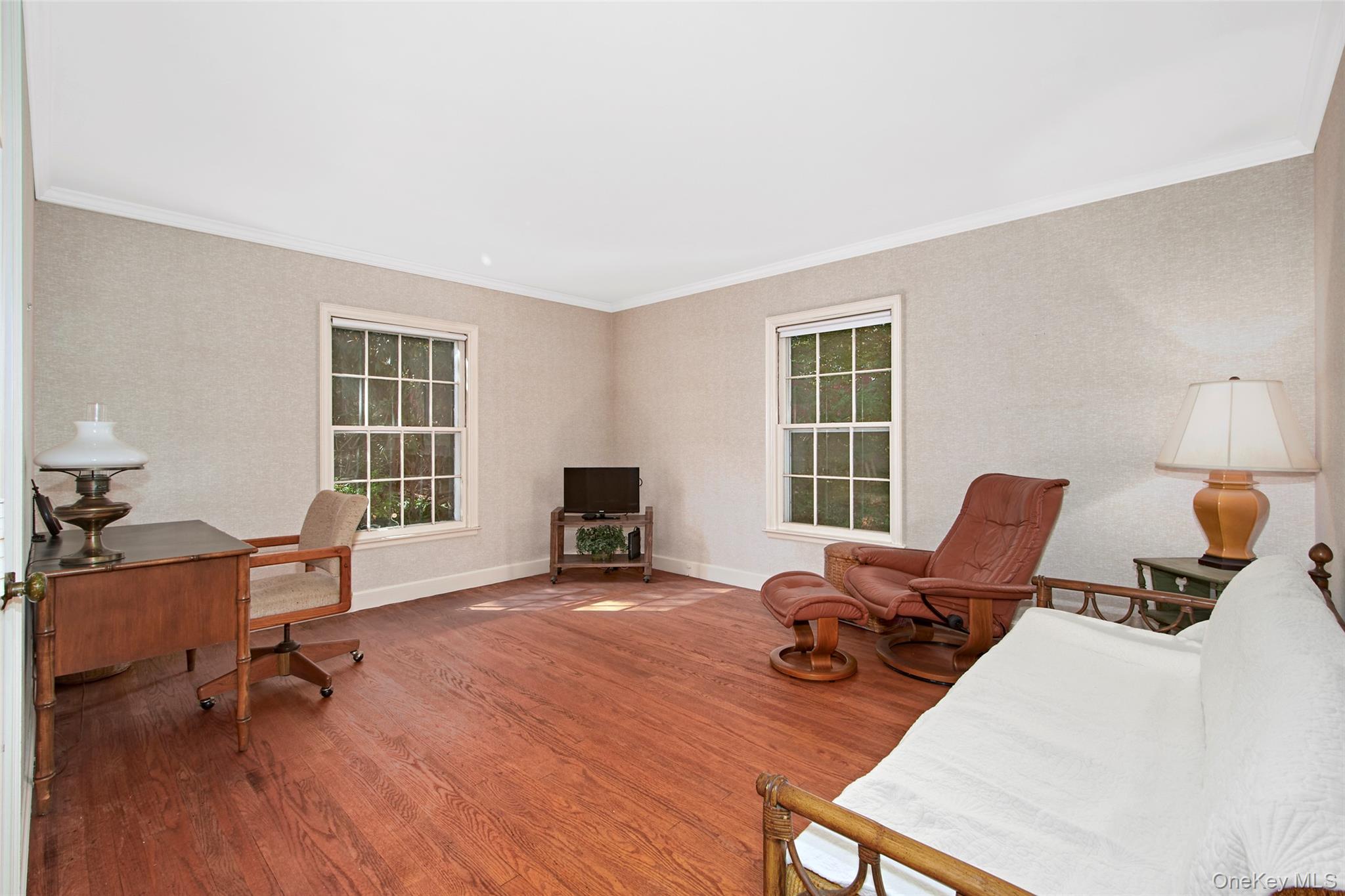 71 Commodore Road Chappaqua, NY 10514 - Photo 19 of 39 a view of a livingroom with lounge chair and a window