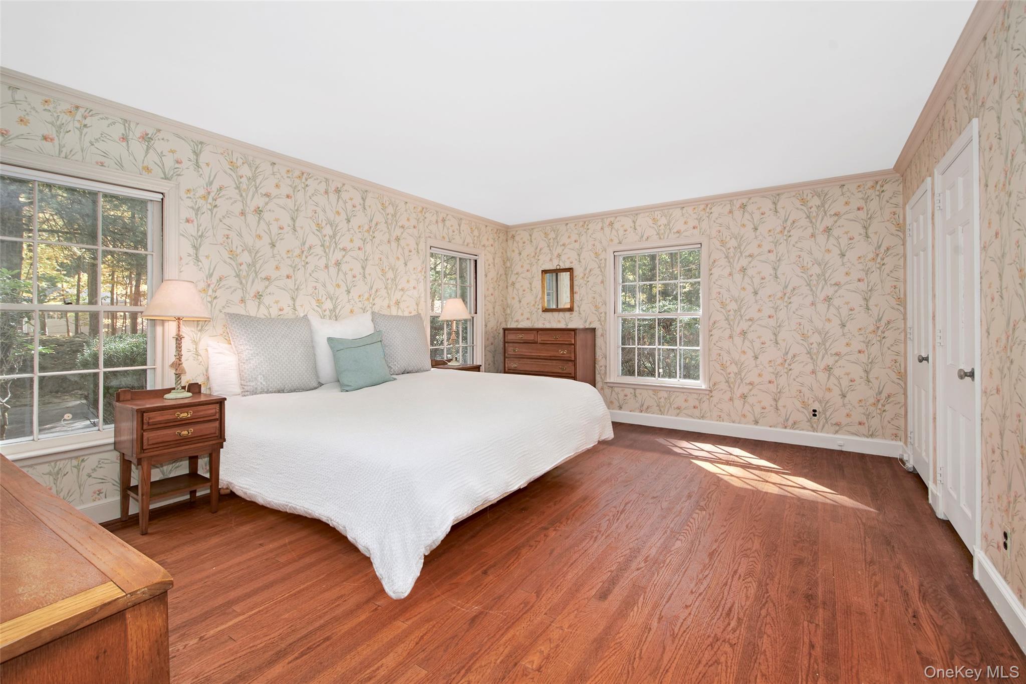 71 Commodore Road Chappaqua, NY 10514 - Photo 21 of 39 a bedroom with a large bed and a large window