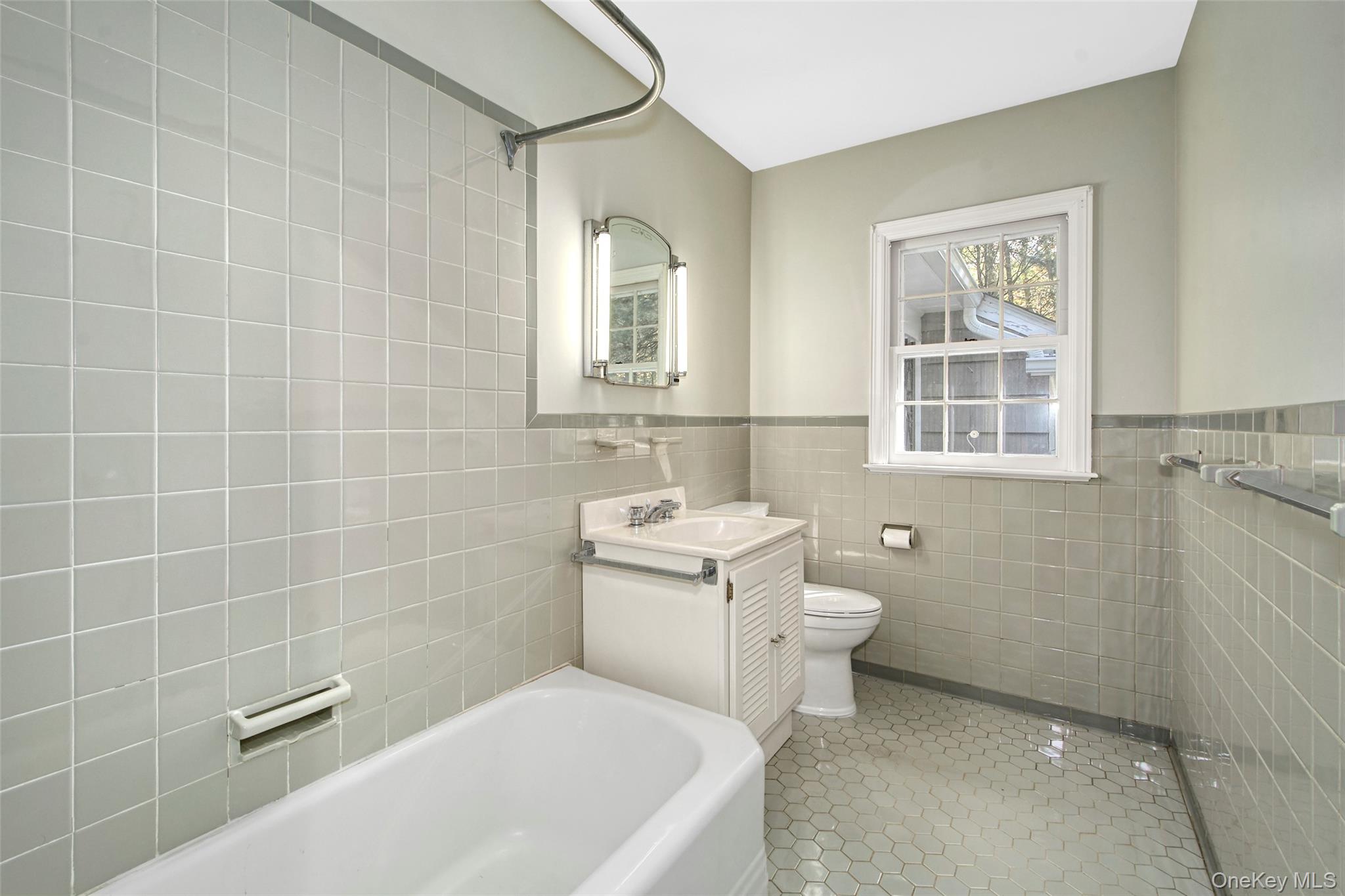 71 Commodore Road Chappaqua, NY 10514 - Photo 23 of 39 a bathroom with a sink a toilet and shower