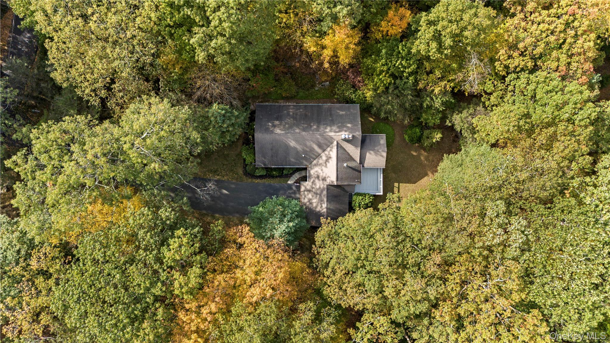 71 Commodore Road Chappaqua, NY 10514 - Photo 33 of 39 front view of a house with a yard