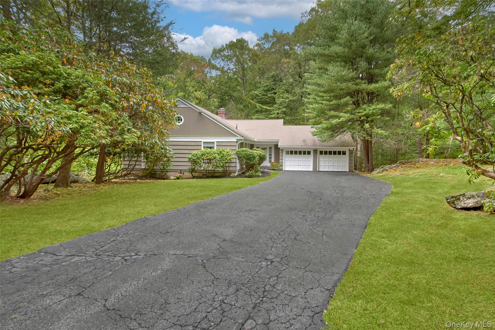 71 Commodore Road Chappaqua, NY 10514 - Photo 35 of 39 a view of a house with a yard