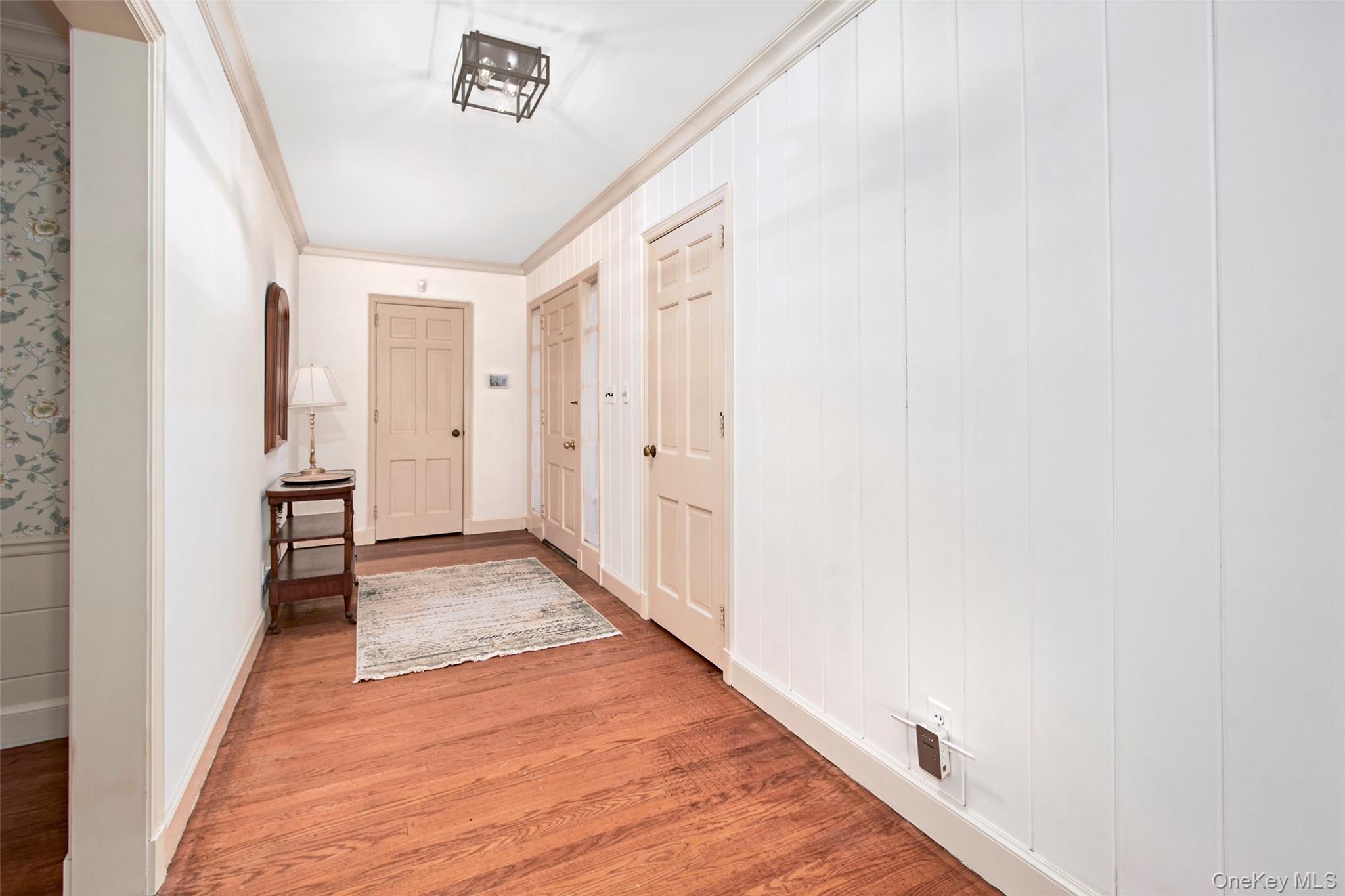 71 Commodore Road Chappaqua, NY 10514 - Photo 4 of 39 a view of a hallway with wooden floor