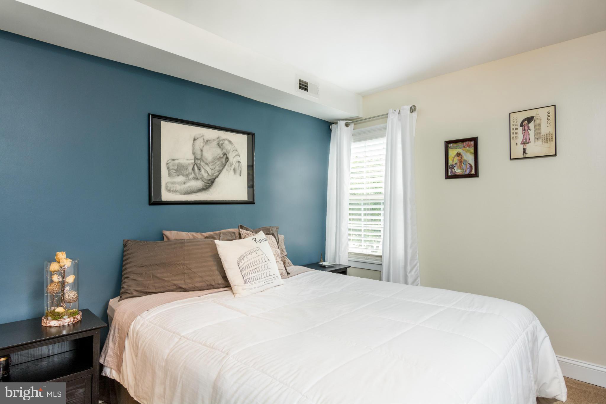 12 Township Road Baltimore, MD 21222 - Photo 17 of 25 a bedroom with a bed and a painting on the wall