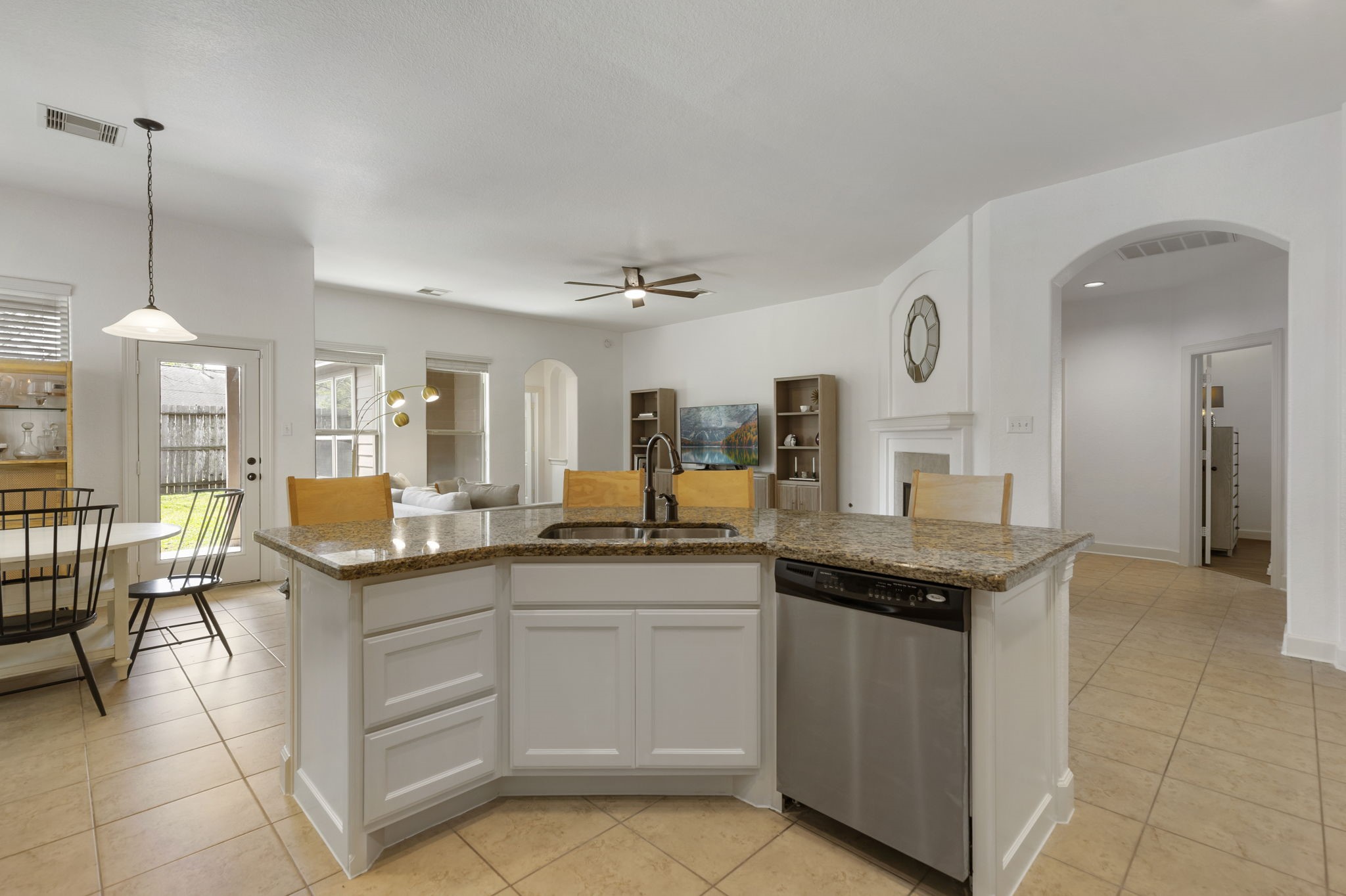 71 Sagamore Ridge Place The Woodlands, TX 77389 - Photo 10 of 34 a kitchen with granite countertop a sink and cabinets