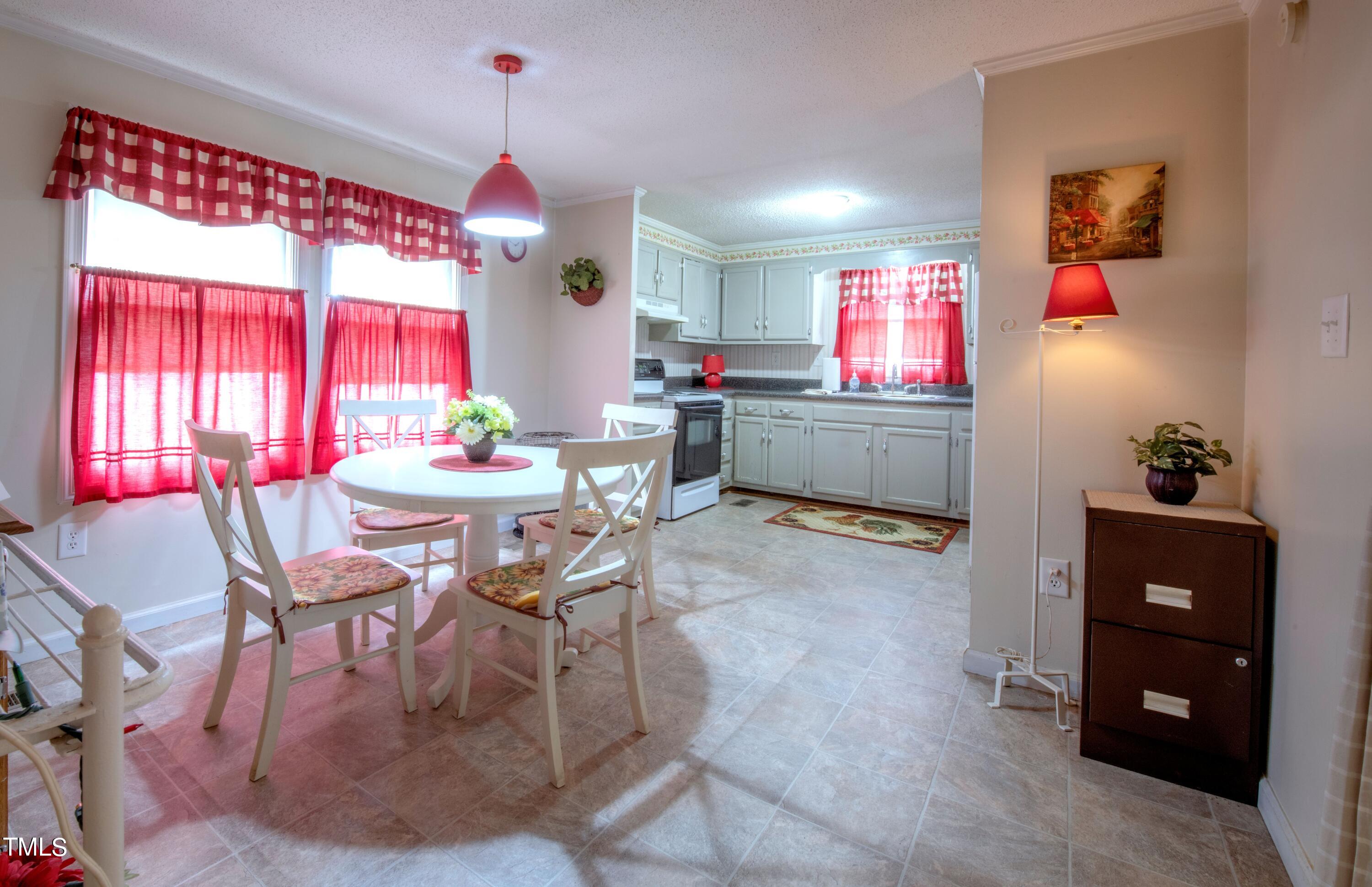 4180 Brantley Road Zebulon, NC 27597 - Photo 7 of 15 a dining room with furniture and window