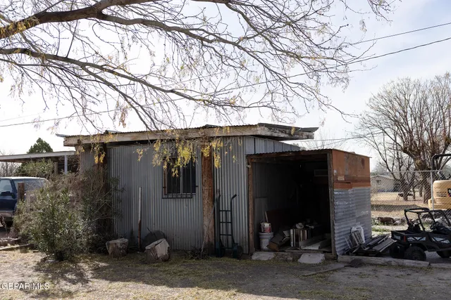 a view of lobby with a couch and a potted plant