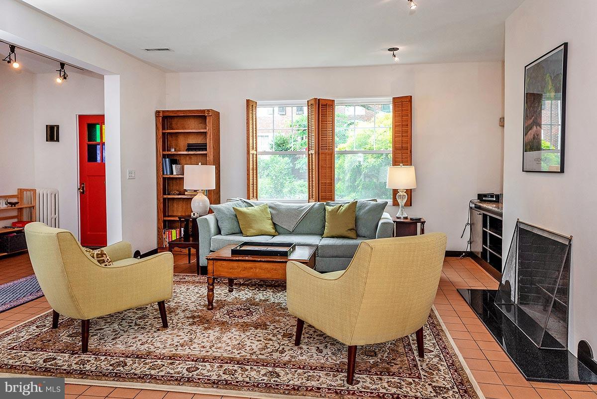 3924 Cloverhill Road Baltimore, MD 21218 - Photo 3 of 30 a living room with furniture a rug and a large window
