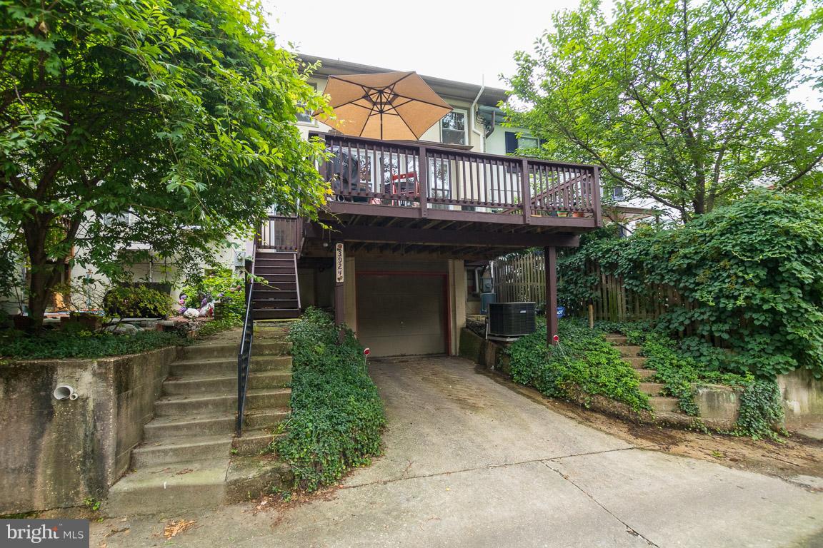 3924 Cloverhill Road Baltimore, MD 21218 - Photo 26 of 30 a view of a house with wooden deck and backyard