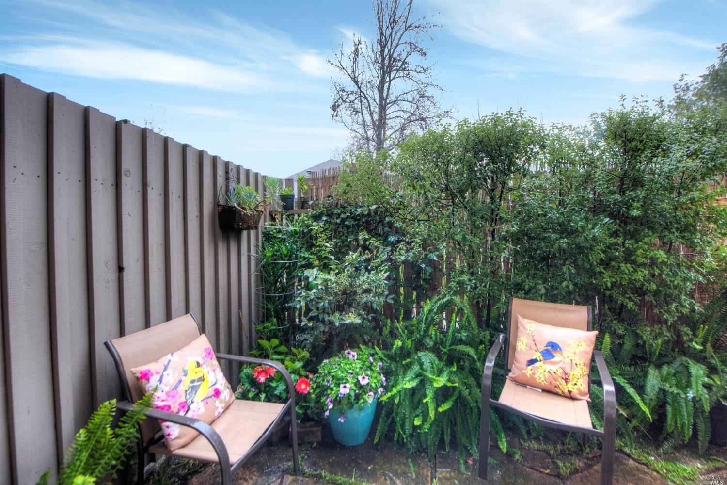 swimming outdoor space with patio furniture and potted plants