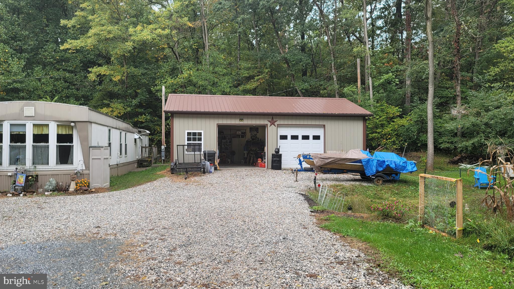 1711 Burkholder Road Red Lion, PA 17356 - Photo 1 of 24 a view of a house with backyard porch and sitting area