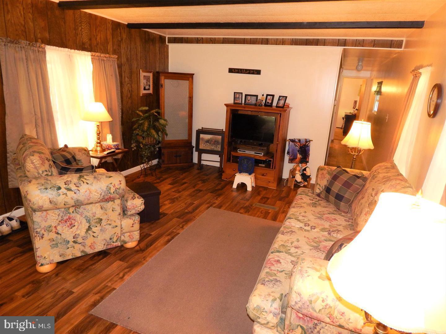 1711 Burkholder Road Red Lion, PA 17356 - Photo 11 of 24 a living room with furniture and a flat screen tv