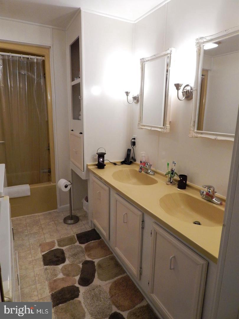 1711 Burkholder Road Red Lion, PA 17356 - Photo 13 of 24 a bathroom with a sink and a mirror