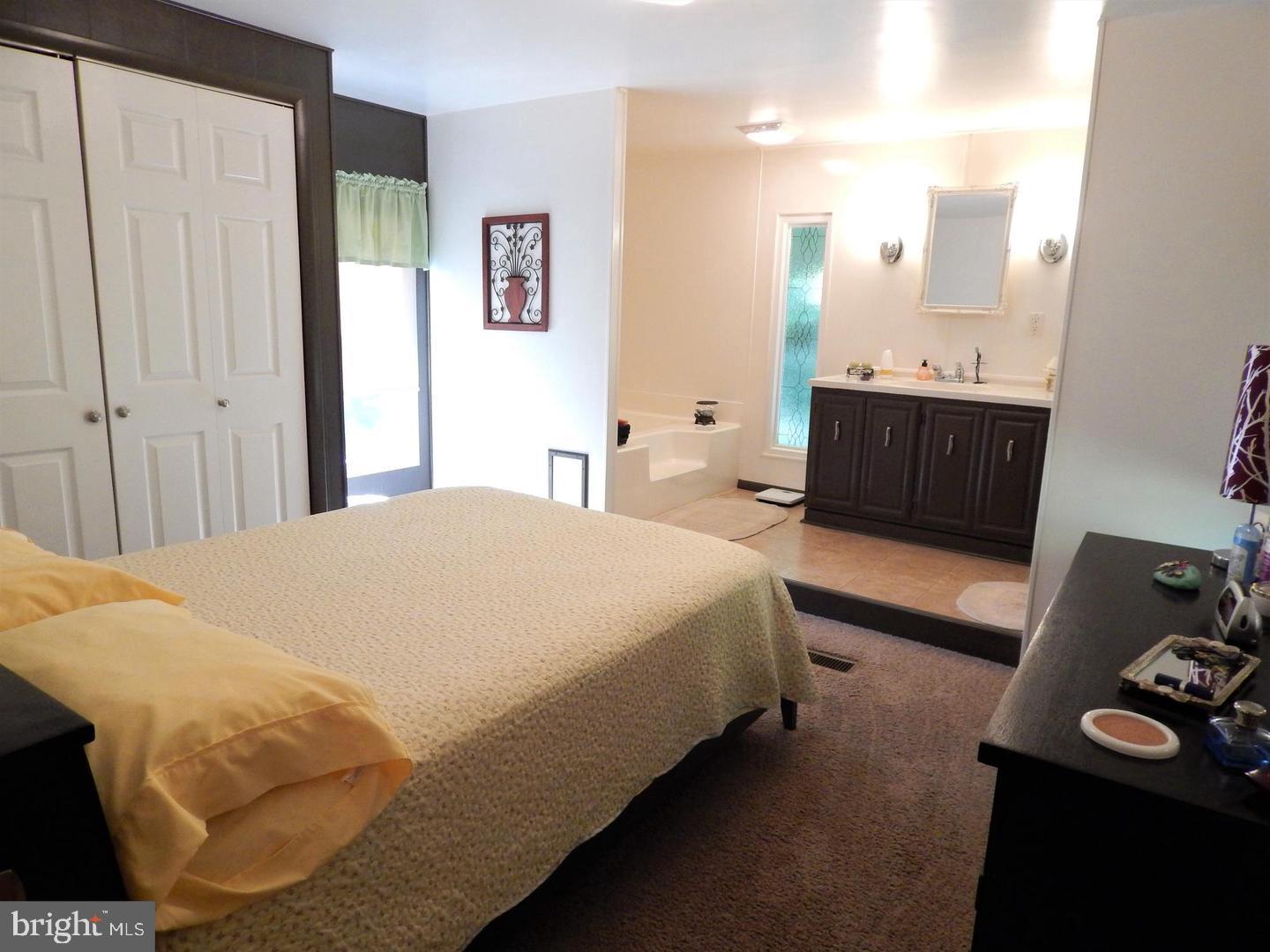 1711 Burkholder Road Red Lion, PA 17356 - Photo 15 of 24 a bedroom with a bed and a mirror