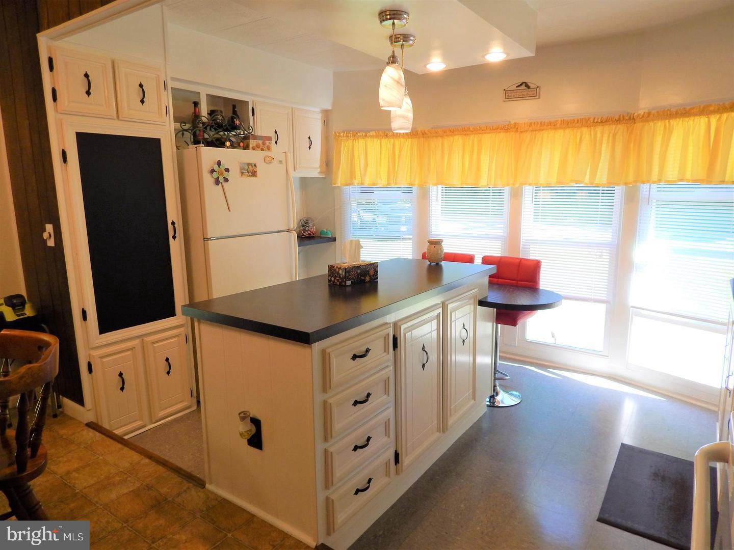 1711 Burkholder Road Red Lion, PA 17356 - Photo 4 of 24 a kitchen with stainless steel appliances cabinets and a large window