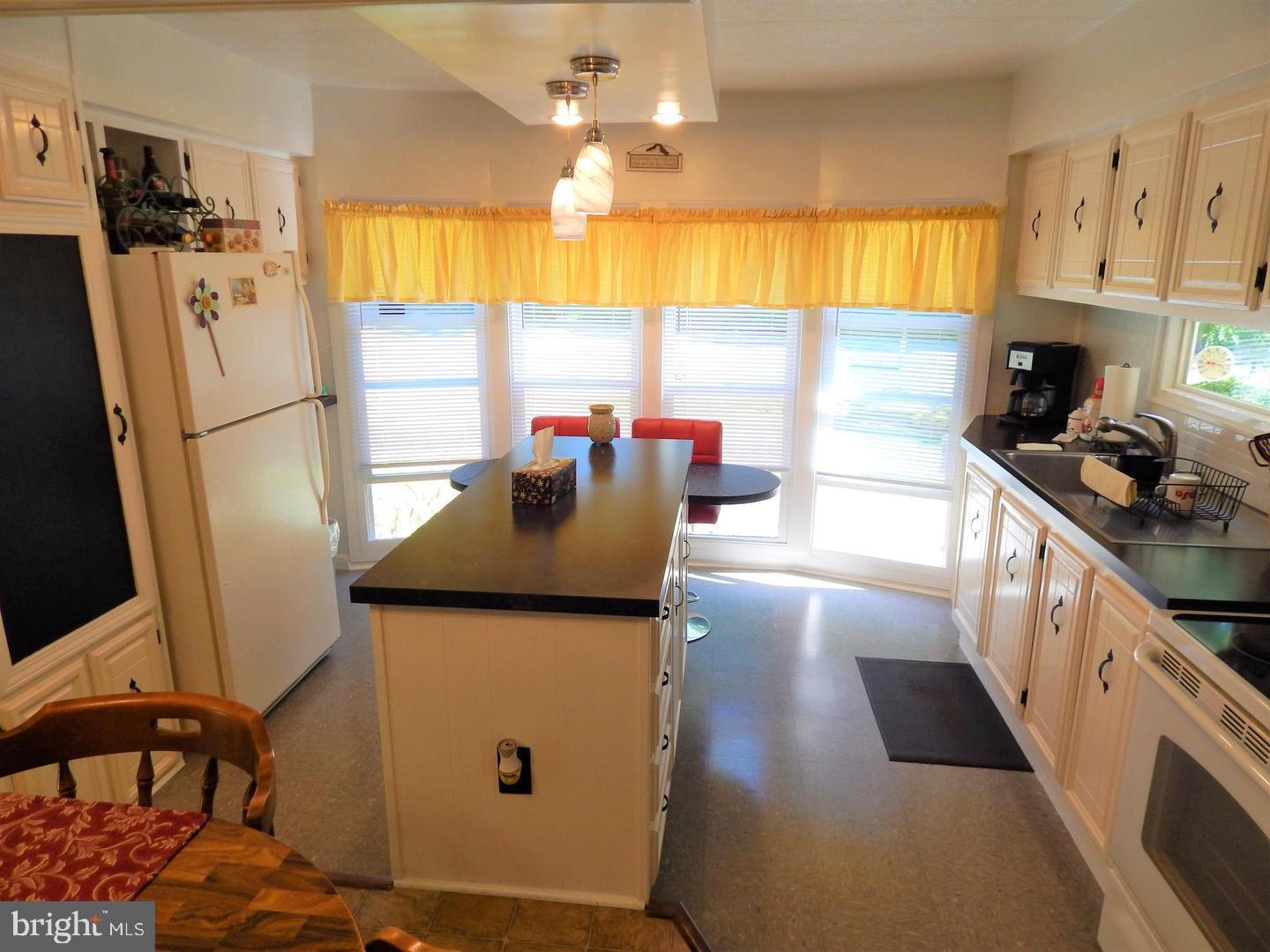 1711 Burkholder Road Red Lion, PA 17356 - Photo 5 of 24 a kitchen with stainless steel appliances granite countertop a sink stove and refrigerator