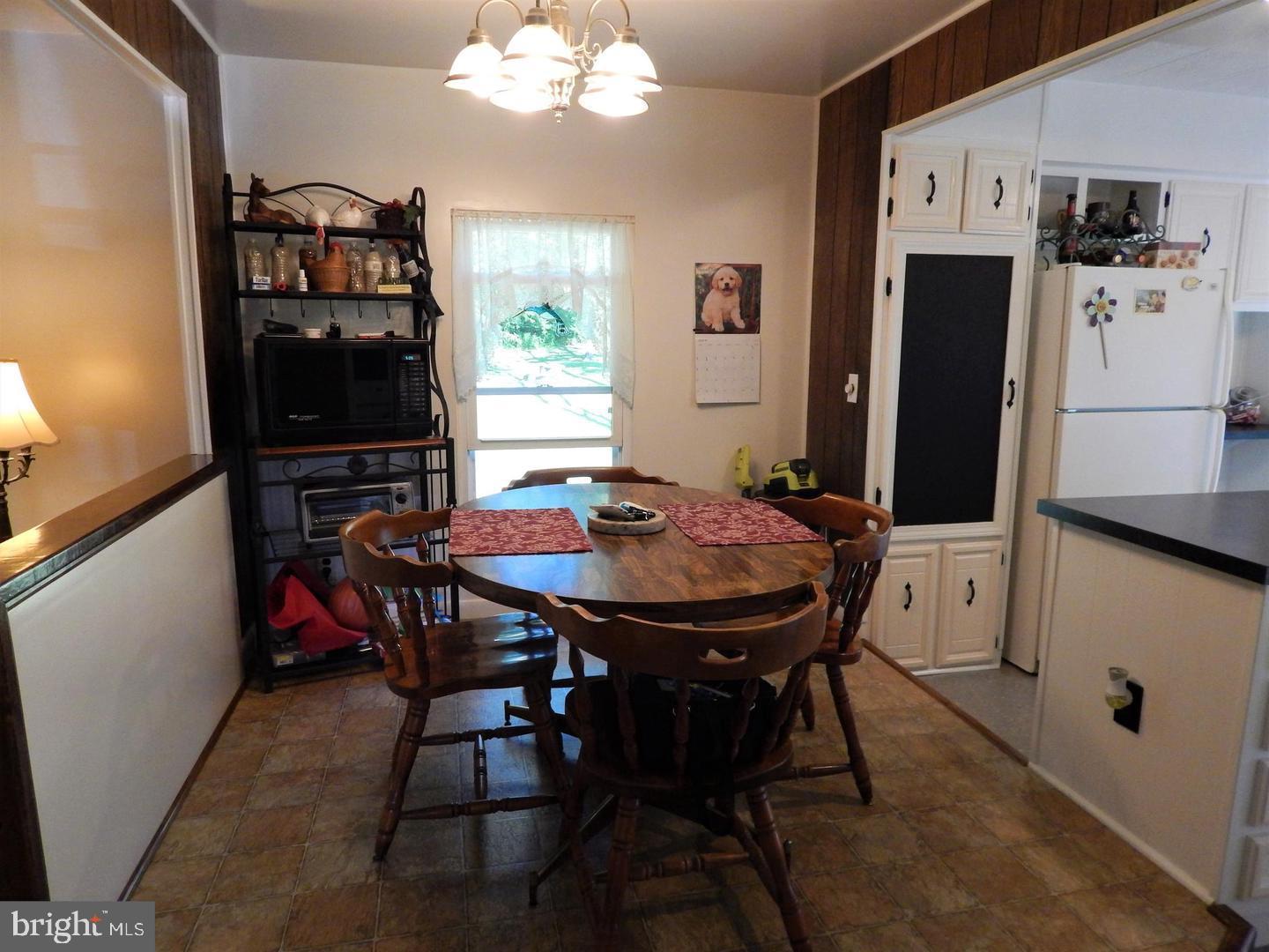 1711 Burkholder Road Red Lion, PA 17356 - Photo 8 of 24 a view of a dining room with furniture and chandelier