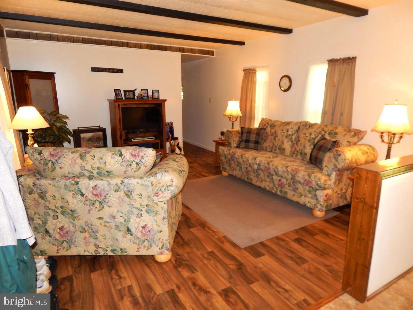 1711 Burkholder Road Red Lion, PA 17356 - Photo 9 of 24 a living room with furniture and a flat screen tv