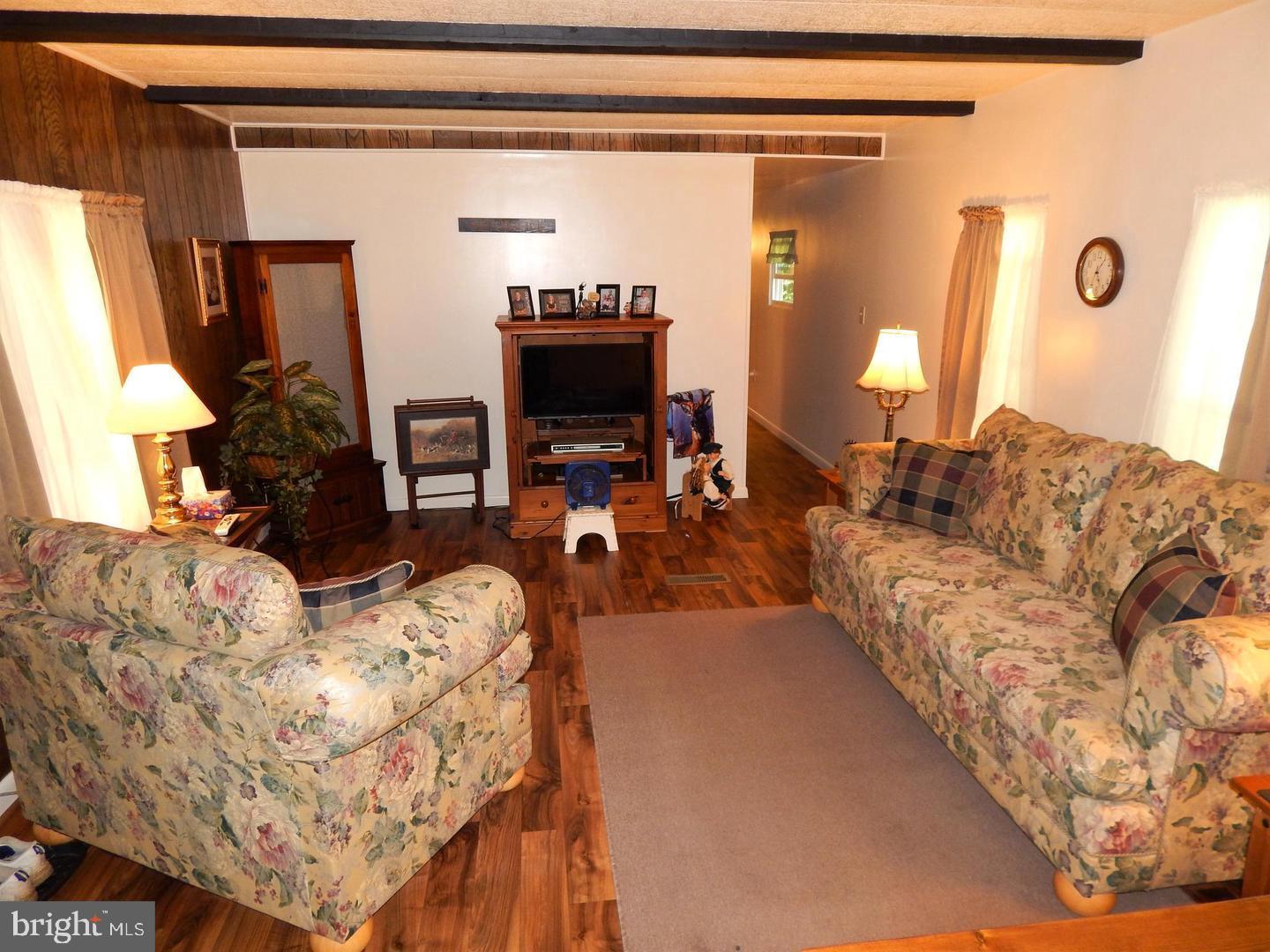 1711 Burkholder Road Red Lion, PA 17356 - Photo 10 of 24 a living room with furniture and a flat screen tv