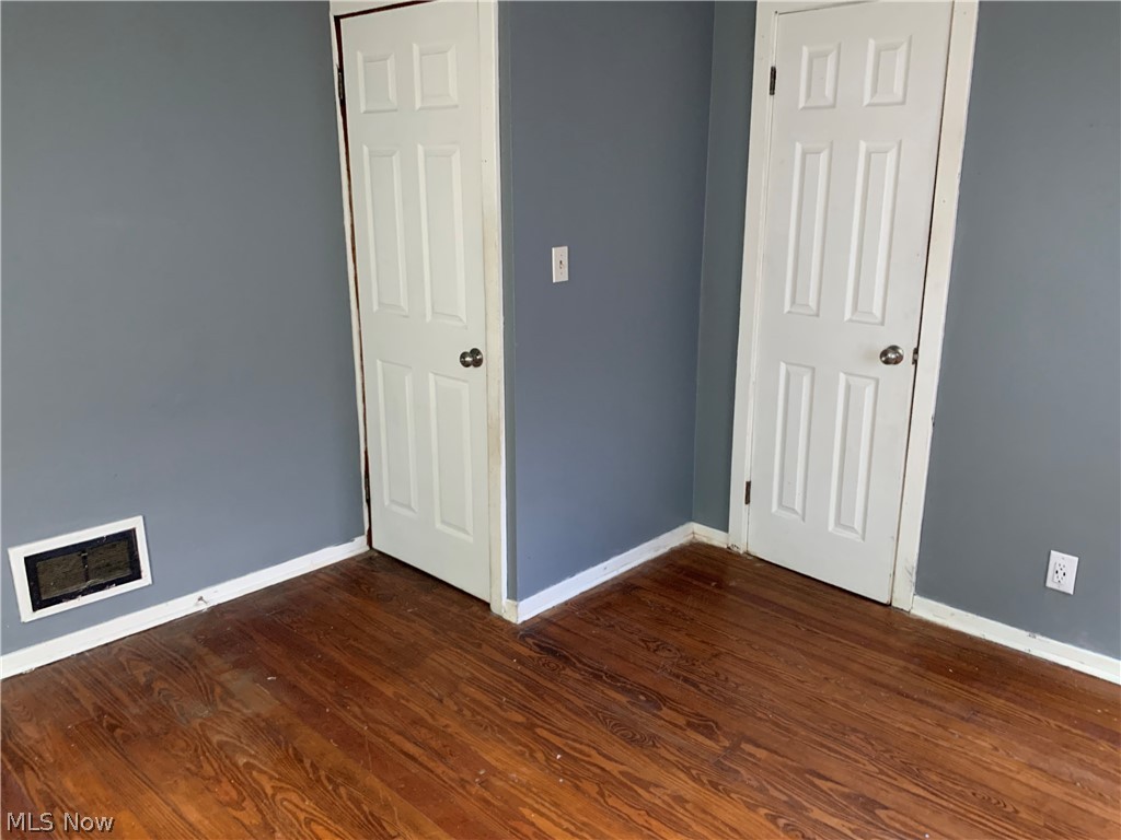 176 North Seneca Street Rittman, OH 44270 - Photo 6 of 14 Unfurnished room featuring dark wood-type flooring