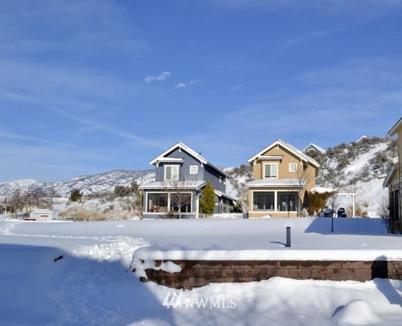 94 Veranda Drive Oroville, WA 98844 - Photo 9 of 11 a front view of a house with a yard