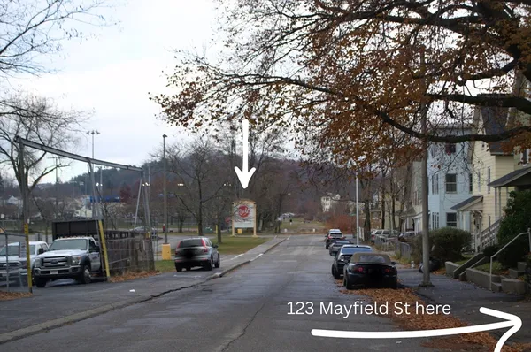 a view of street with parked cars