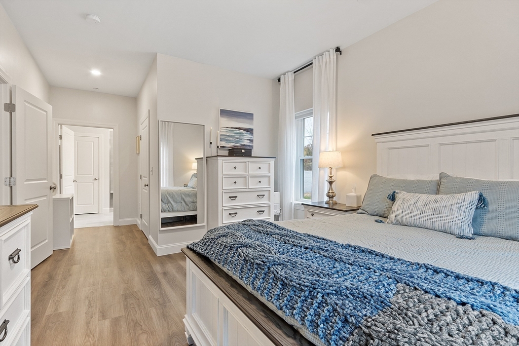 3202 Briarwood Village, Unit 3202 Clinton, MA 01510 - Photo 21 of 35 a large bedroom with a bed and a cabinets
