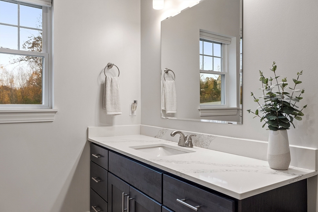 3202 Briarwood Village, Unit 3202 Clinton, MA 01510 - Photo 22 of 35 a bathroom with a sink and a mirror