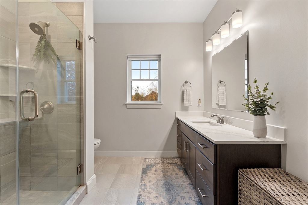 3202 Briarwood Village, Unit 3202 Clinton, MA 01510 - Photo 24 of 35 a bathroom with a double vanity sink mirror and shower