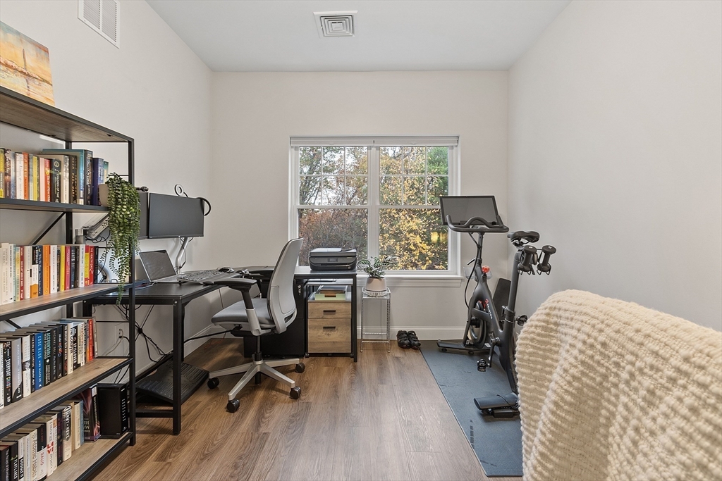3202 Briarwood Village, Unit 3202 Clinton, MA 01510 - Photo 27 of 35 a view of a workspace with furniture and a bookshelf