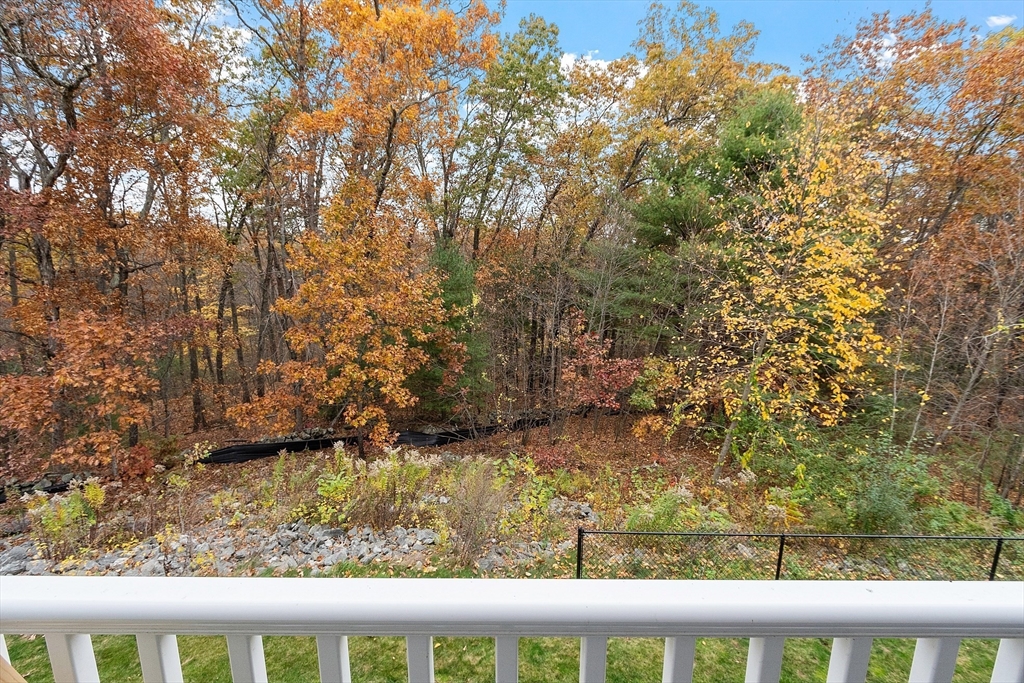 3202 Briarwood Village, Unit 3202 Clinton, MA 01510 - Photo 5 of 35 a view of a yard from a balcony