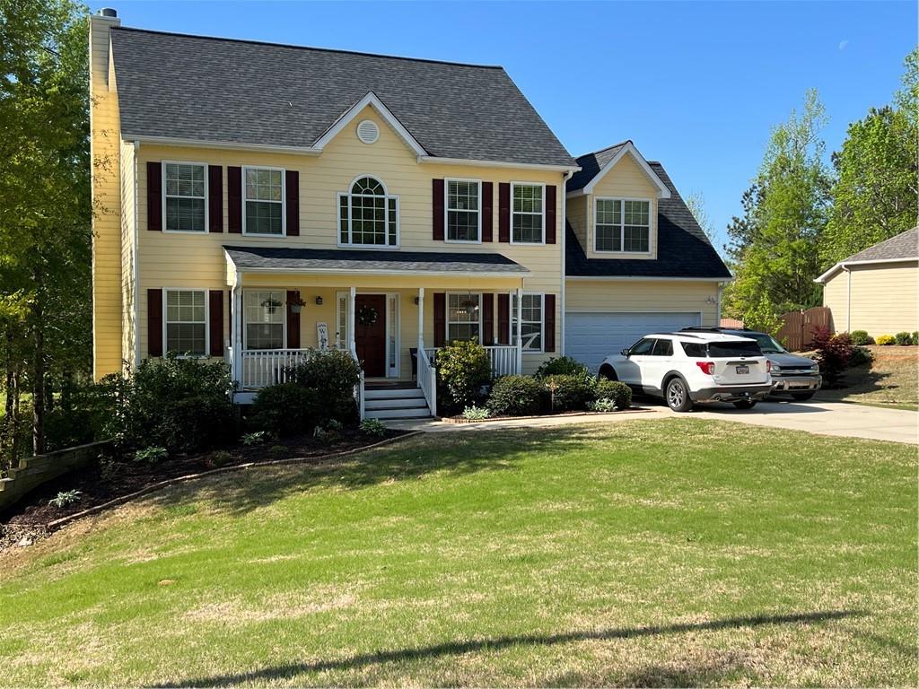 9725 Moss Pointe Path Villa Rica, GA 30180 - Photo 1 of 1 a front view of a house with swimming pool having outdoor seating