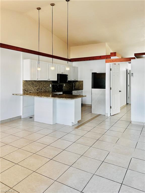 826 Wiggins Pass Road, Unit 307 Naples, FL 34110 - Photo 11 of 17 a view of a kitchen with a sink