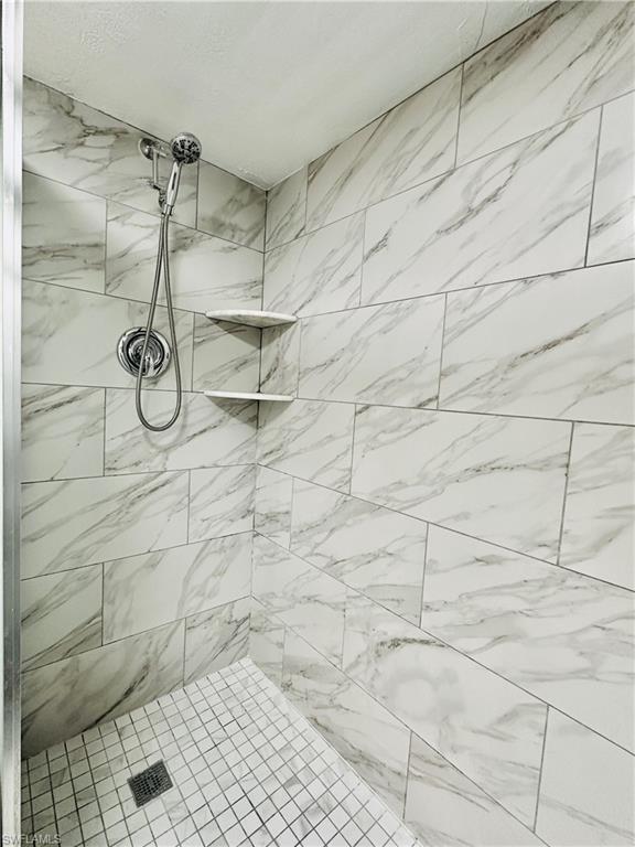 826 Wiggins Pass Road, Unit 307 Naples, FL 34110 - Photo 16 of 17 a bathroom with a shower