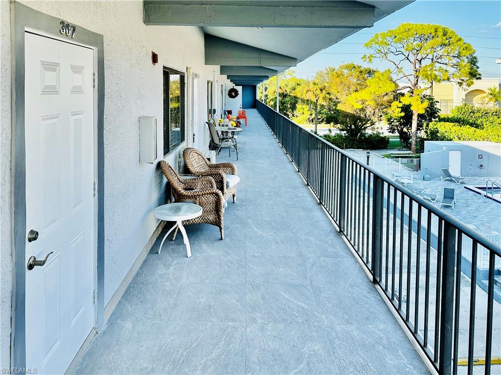 826 Wiggins Pass Road, Unit 307 Naples, FL 34110 - Photo 3 of 17 a view of a balcony
