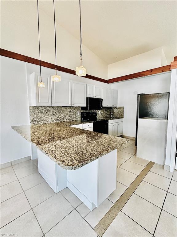 826 Wiggins Pass Road, Unit 307 Naples, FL 34110 - Photo 5 of 17 a kitchen with stainless steel appliances granite countertop a sink stove and cabinets