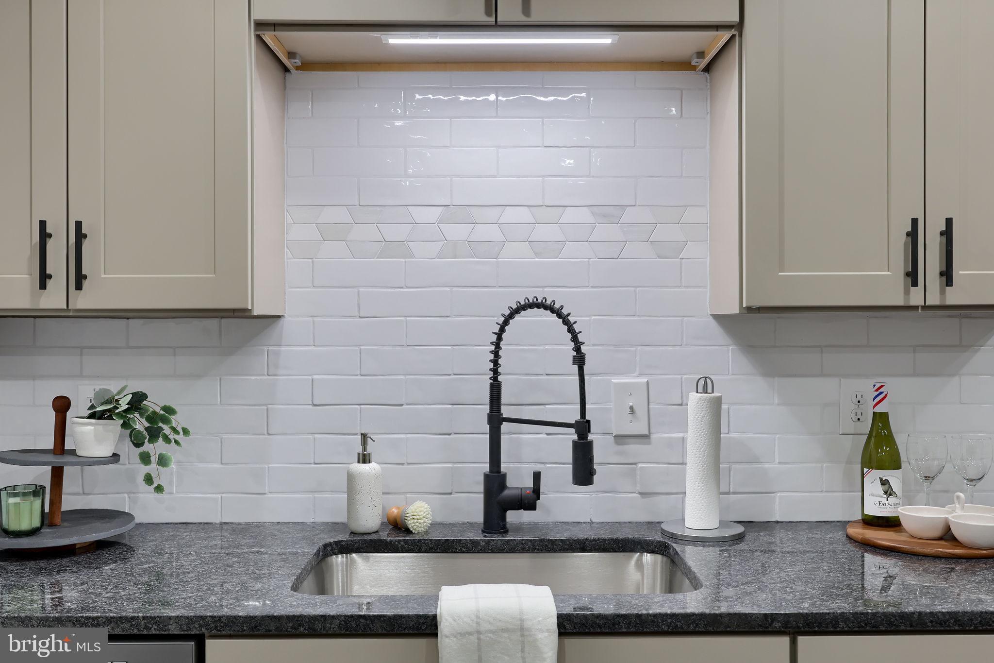 244 South 5th Street Columbia, PA 17512 - Photo 24 of 45 a kitchen with granite countertop a sink and a white cabinets