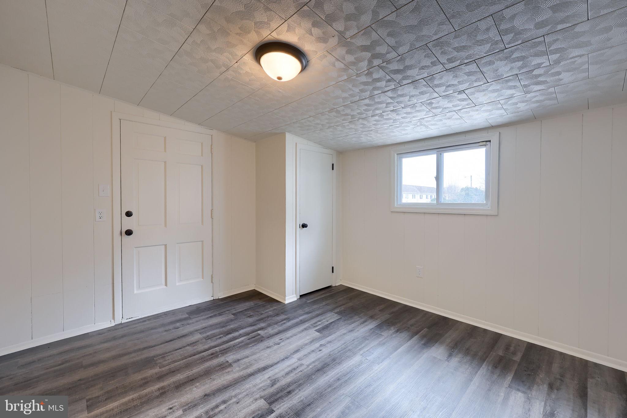 244 South 5th Street Columbia, PA 17512 - Photo 26 of 45 a view of empty room with wooden floor and fan