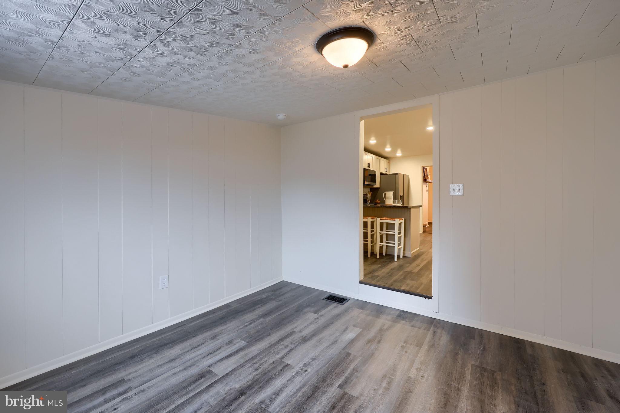 244 South 5th Street Columbia, PA 17512 - Photo 27 of 45 an empty room with wooden floor and windows