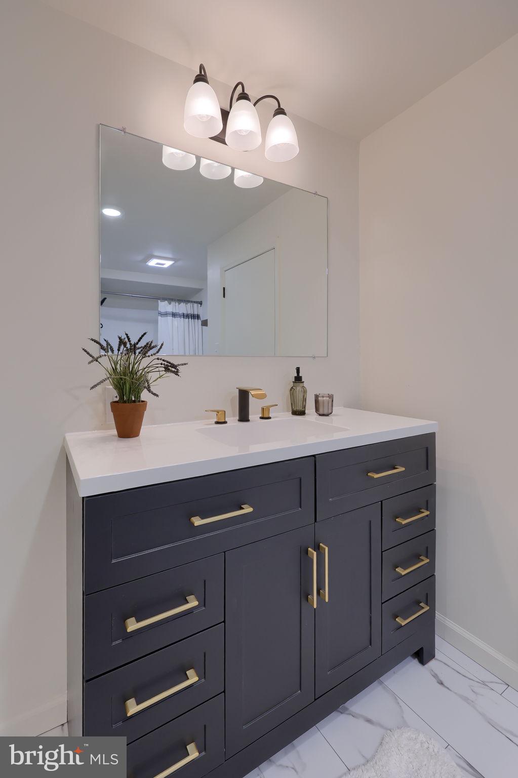 244 South 5th Street Columbia, PA 17512 - Photo 31 of 45 a bathroom with a sink vanity and a mirror