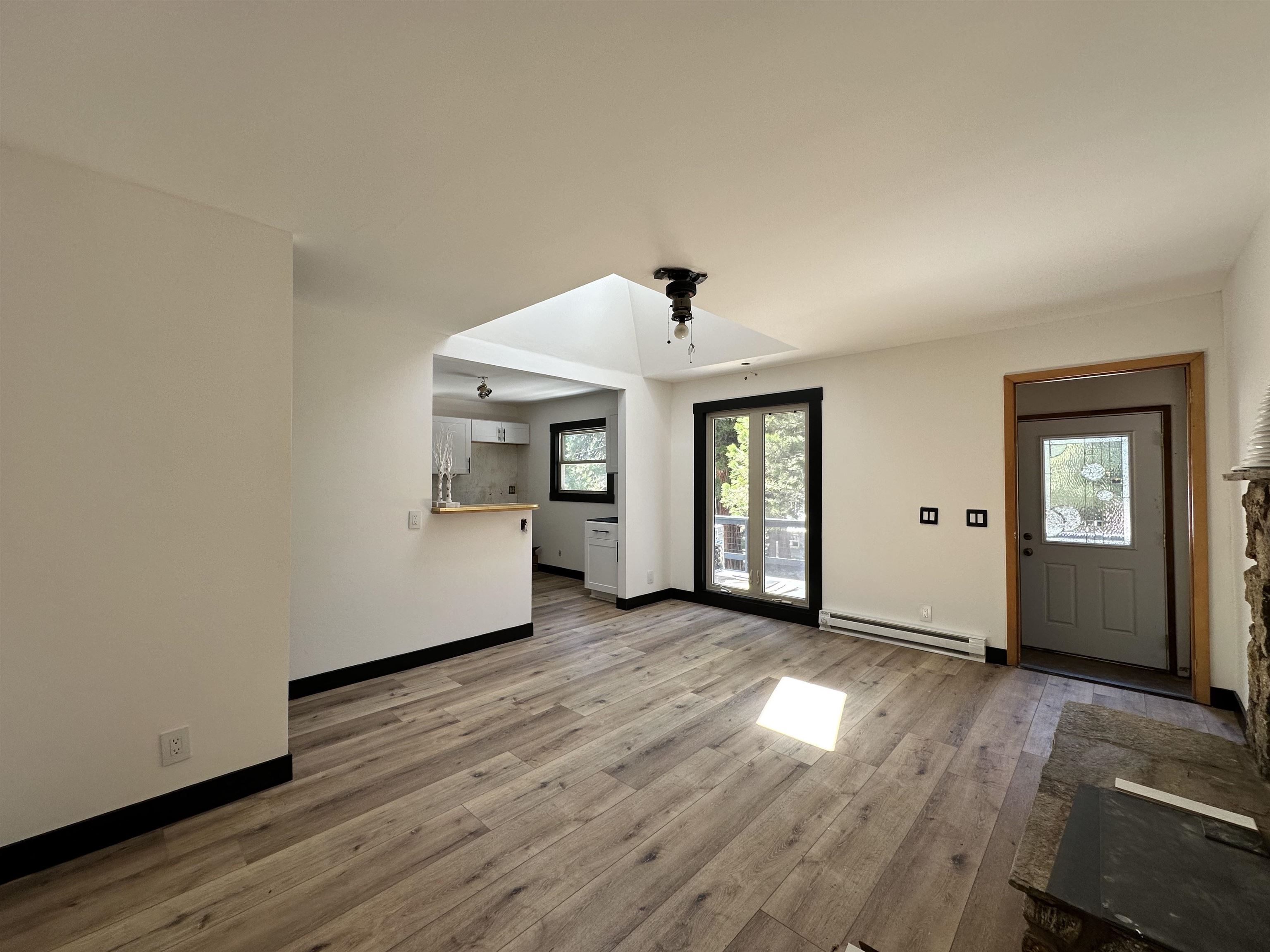 650 Chipmunk Street Kings Beach, CA 96143 - Photo 2 of 8 an empty room with wooden floor and windows
