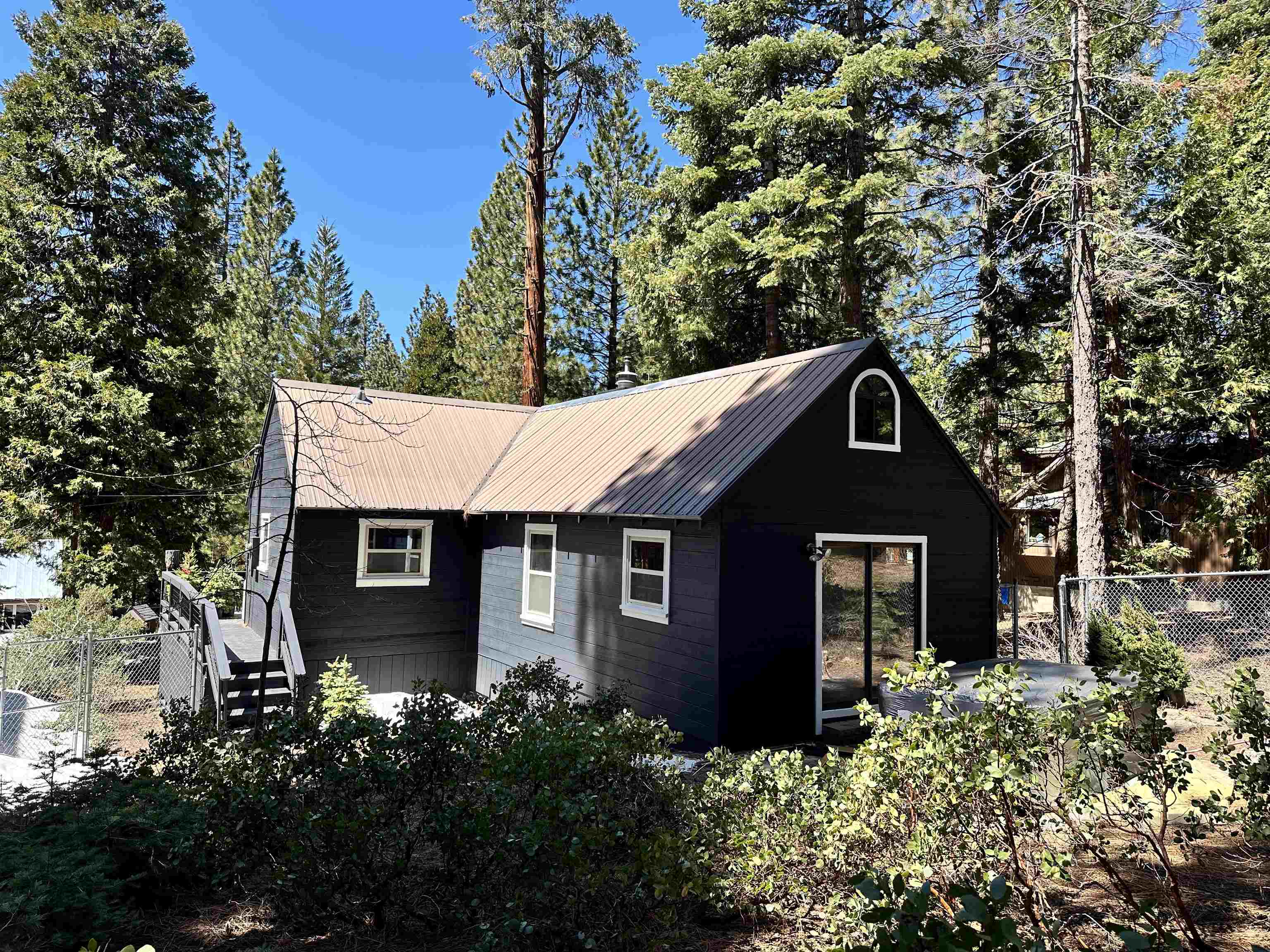 650 Chipmunk Street Kings Beach, CA 96143 - Photo 3 of 8 a front view of a house with a garden