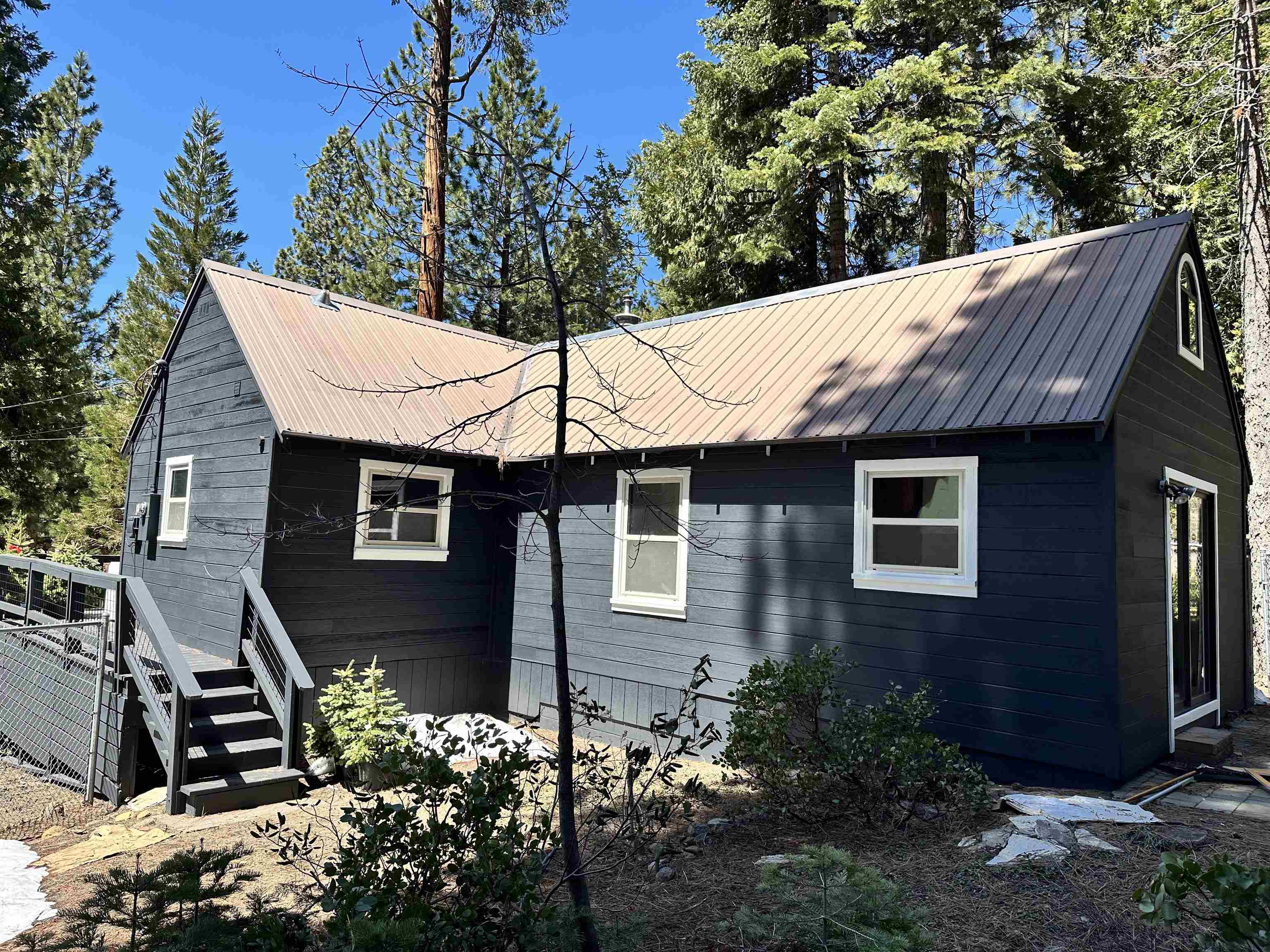 650 Chipmunk Street Kings Beach, CA 96143 - Photo 4 of 8 a backyard of a house with lots of green space