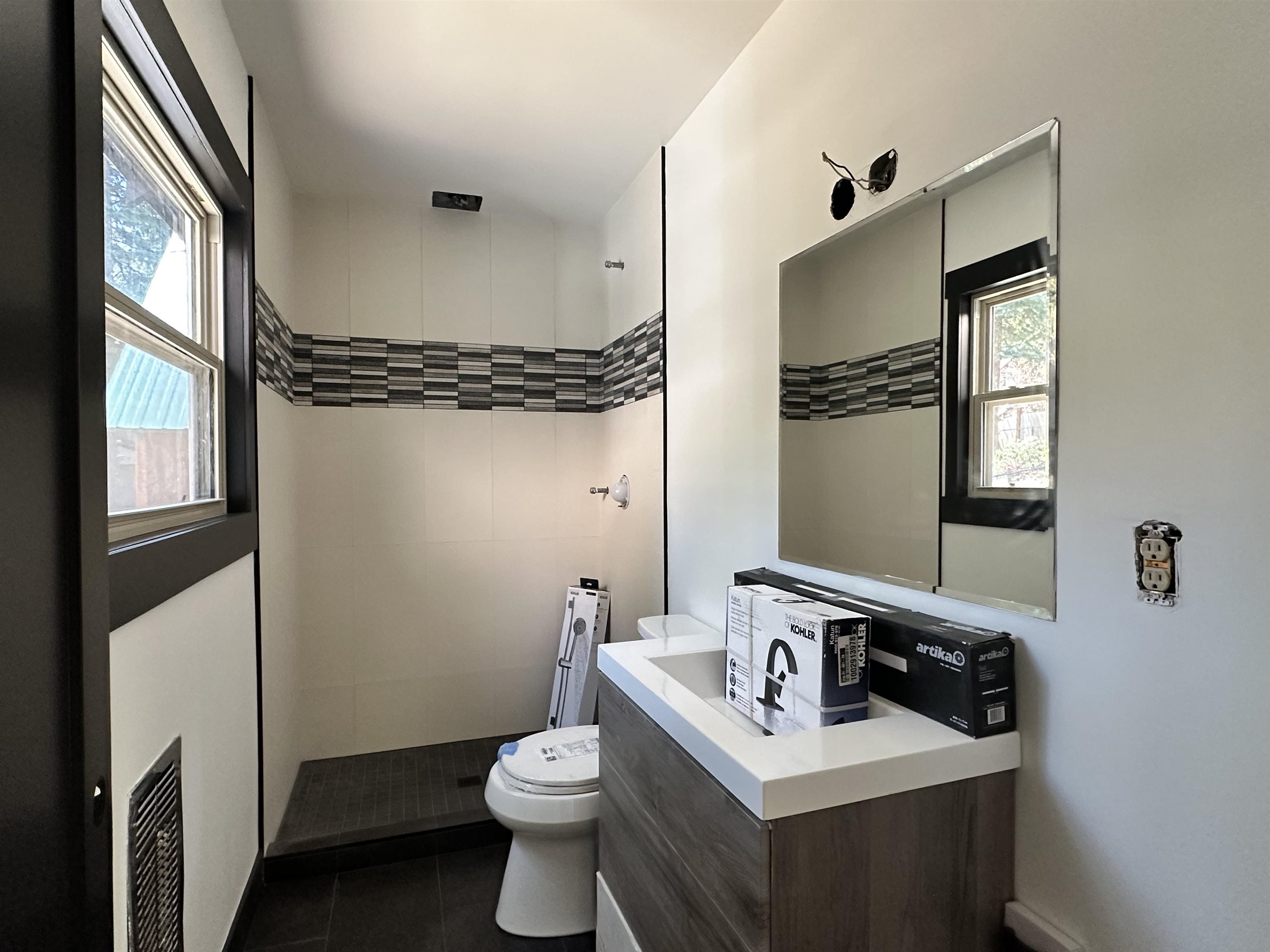 650 Chipmunk Street Kings Beach, CA 96143 - Photo 5 of 8 a bathroom with a sink toilet and mirror