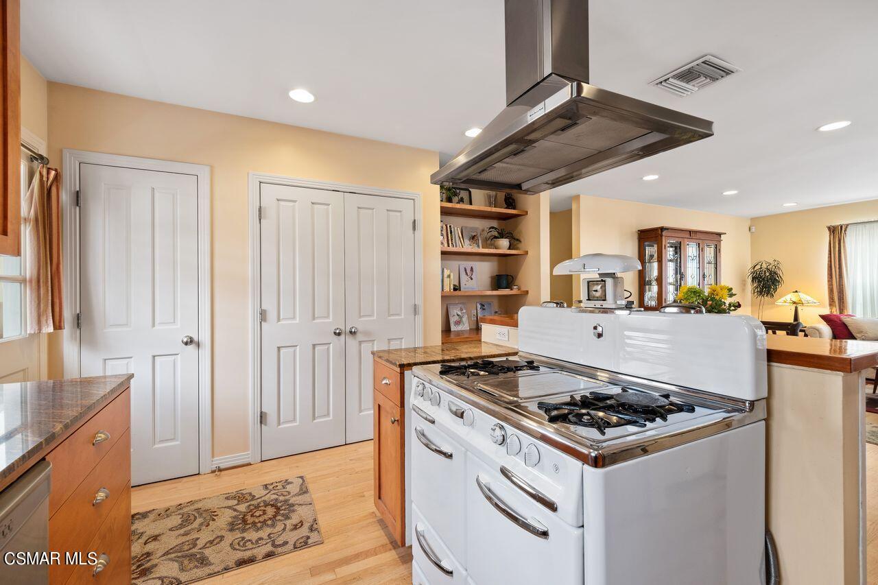 11616 Clarkson Road Los Angeles, CA 90064 - Photo 13 of 34 a kitchen with a stove and a sink