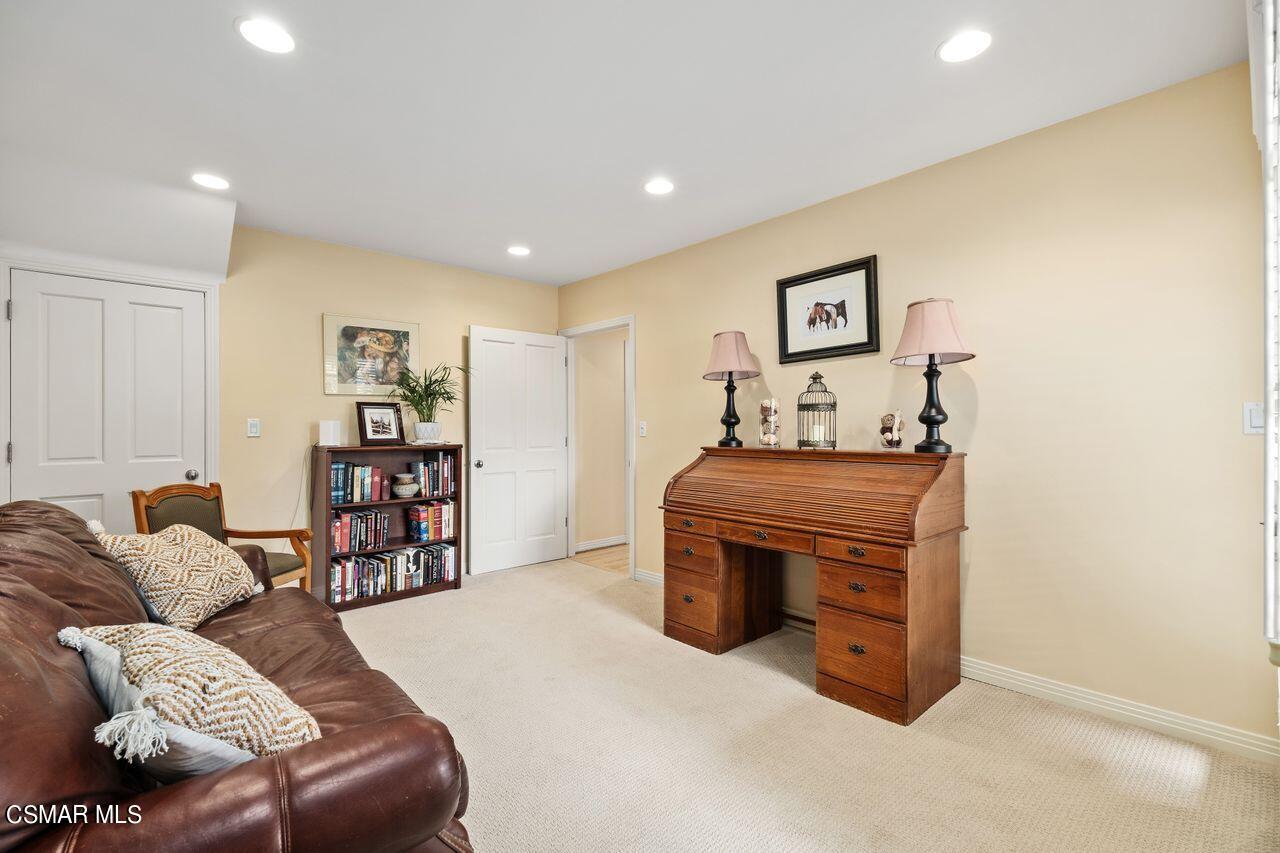 11616 Clarkson Road Los Angeles, CA 90064 - Photo 16 of 34 a living room with furniture and a fireplace