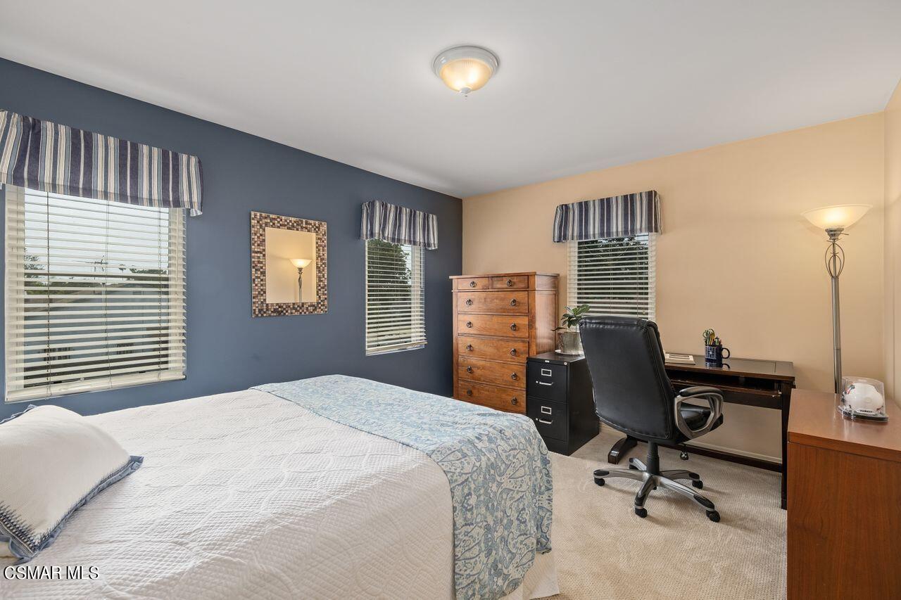 11616 Clarkson Road Los Angeles, CA 90064 - Photo 22 of 34 a bedroom with a bed and a desk