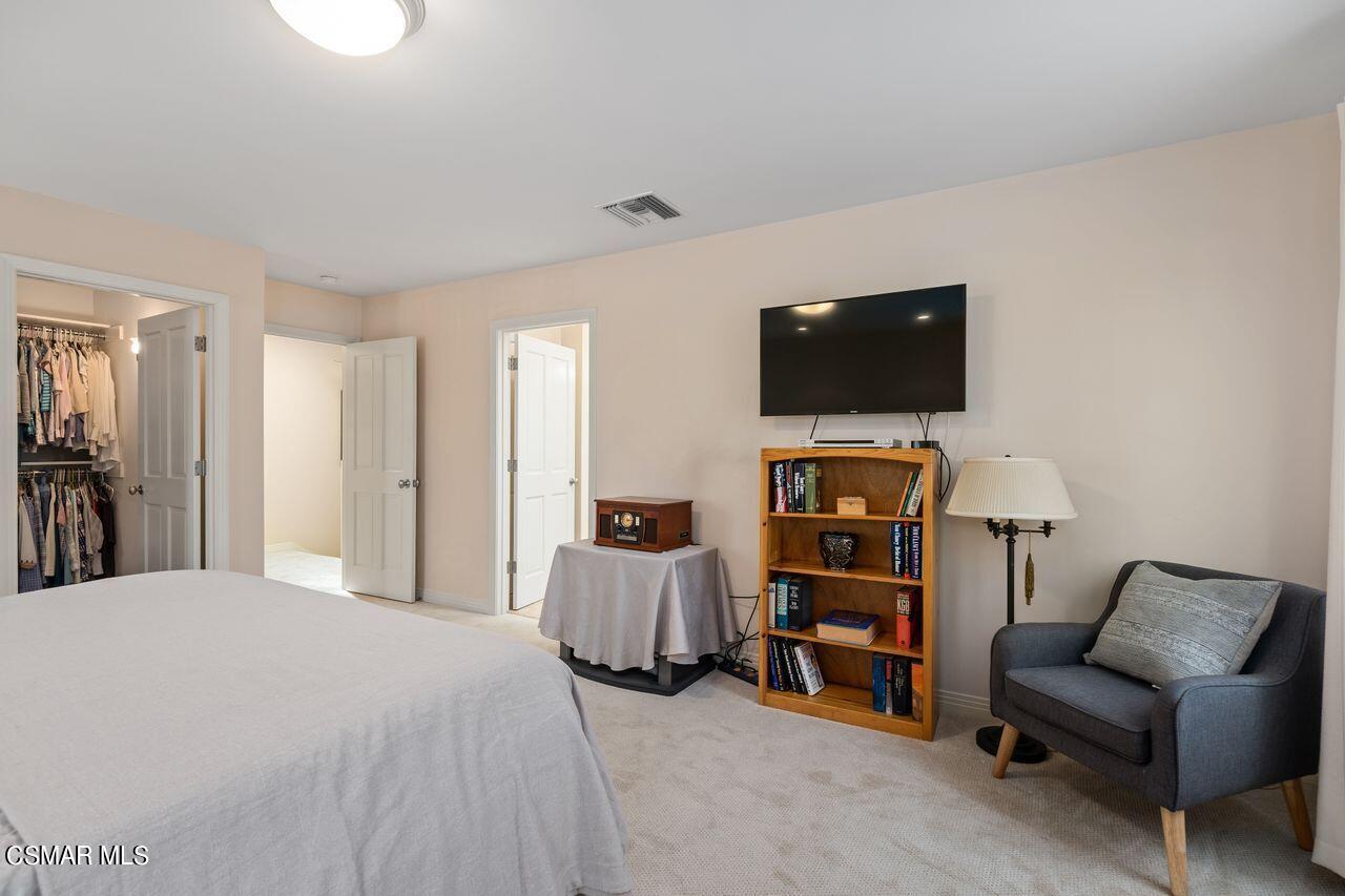 11616 Clarkson Road Los Angeles, CA 90064 - Photo 28 of 34 a bedroom with a bed and a flat screen tv