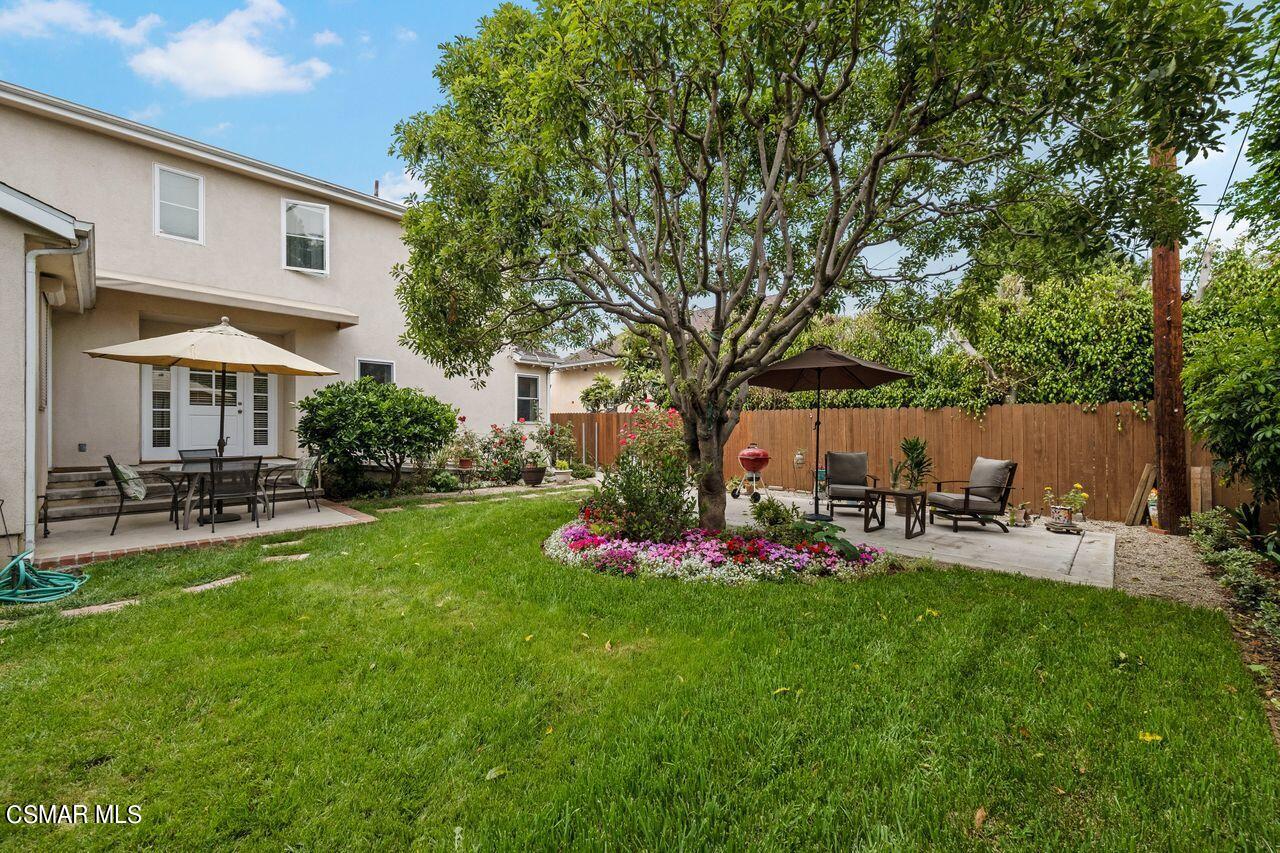 11616 Clarkson Road Los Angeles, CA 90064 - Photo 30 of 34 a view of backyard of house with outdoor seating and green space